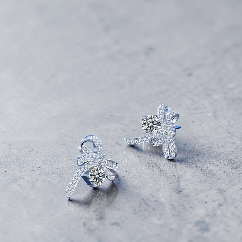 Amara Jewels Sterling Silver Bow Knot Crystal Stud Earrings with shimmering CZ crystals.