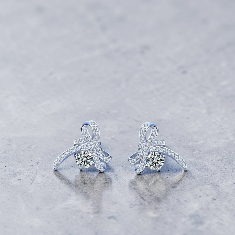 Amara Jewels Sterling Silver Bow Knot Crystal Stud Earrings with shimmering CZ crystals.