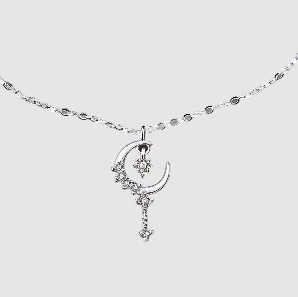 Amara Jewels sterling silver bracelet with a crescent moon and star charm, encrusted with cubic zirconia. Features a delicate chain and adjustable clasp.