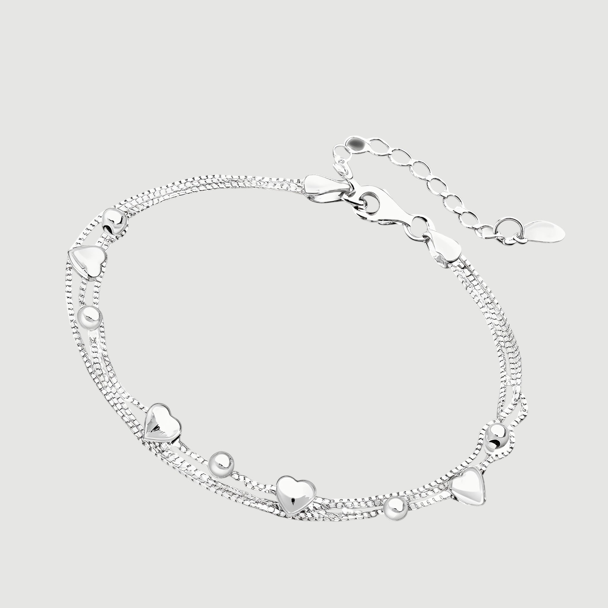 Amara Jewels delicate dual-layered sterling silver bracelet with heart charms and small beads.