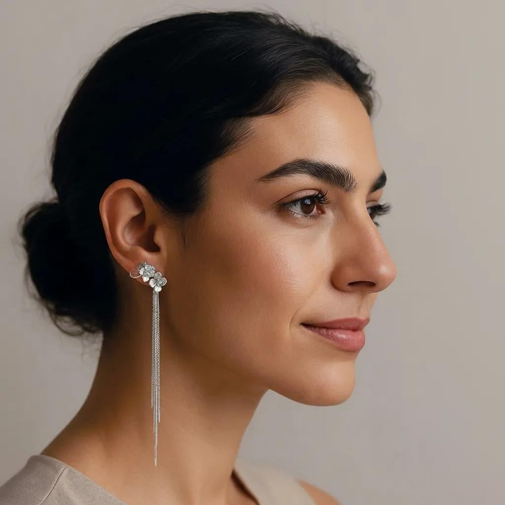 Amara Jewels Sterling Silver Floral Tassel Drop Earrings with delicate floral design and cascading and long, flowing tassels.