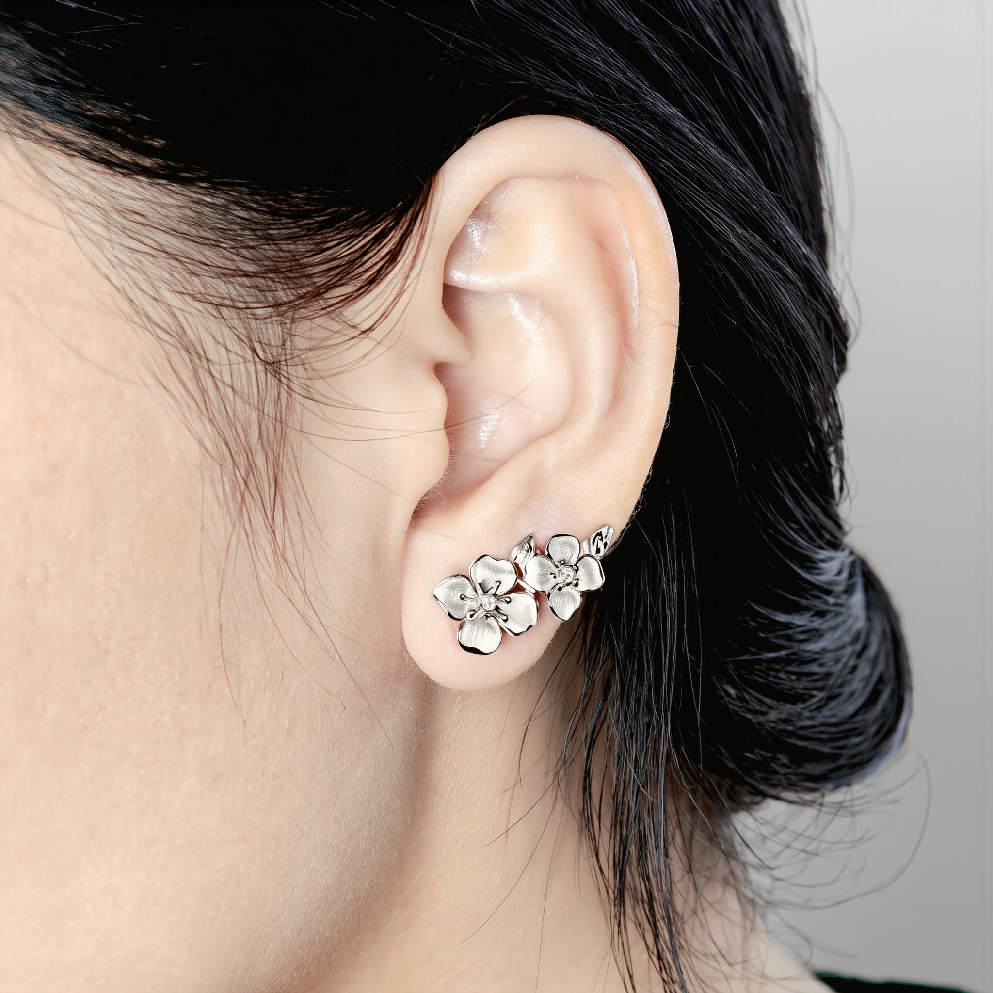 Amara Jewels Sterling Silver Floral Tassel Drop Earrings with delicate floral design and cascading and long, flowing tassels.
