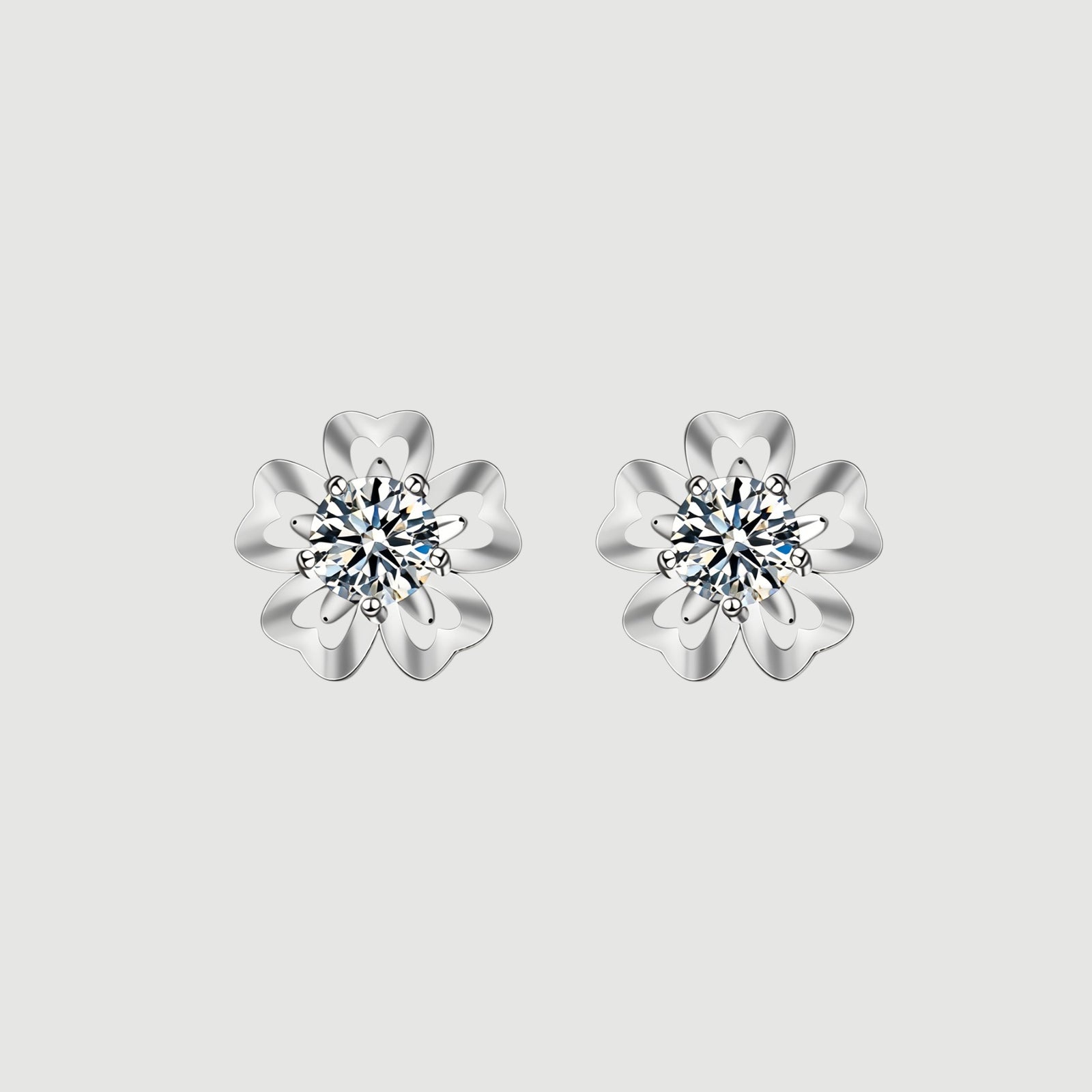 Amara Jewels sterling silver flower petal stud earrings with a central round stone, symbolizing love and elegance.