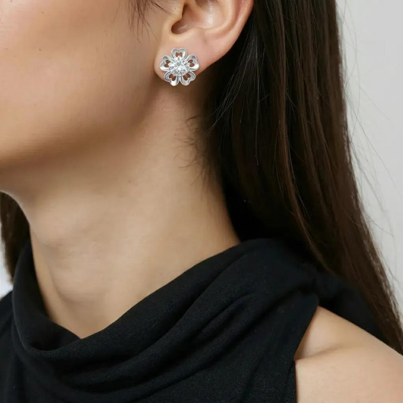Amara Jewels sterling silver flower petal stud earrings with a central round stone, symbolizing love and elegance.