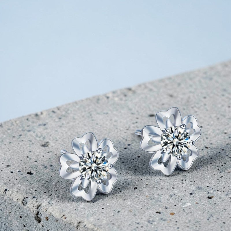 Amara Jewels sterling silver flower petal stud earrings with a central round stone, symbolizing love and elegance.