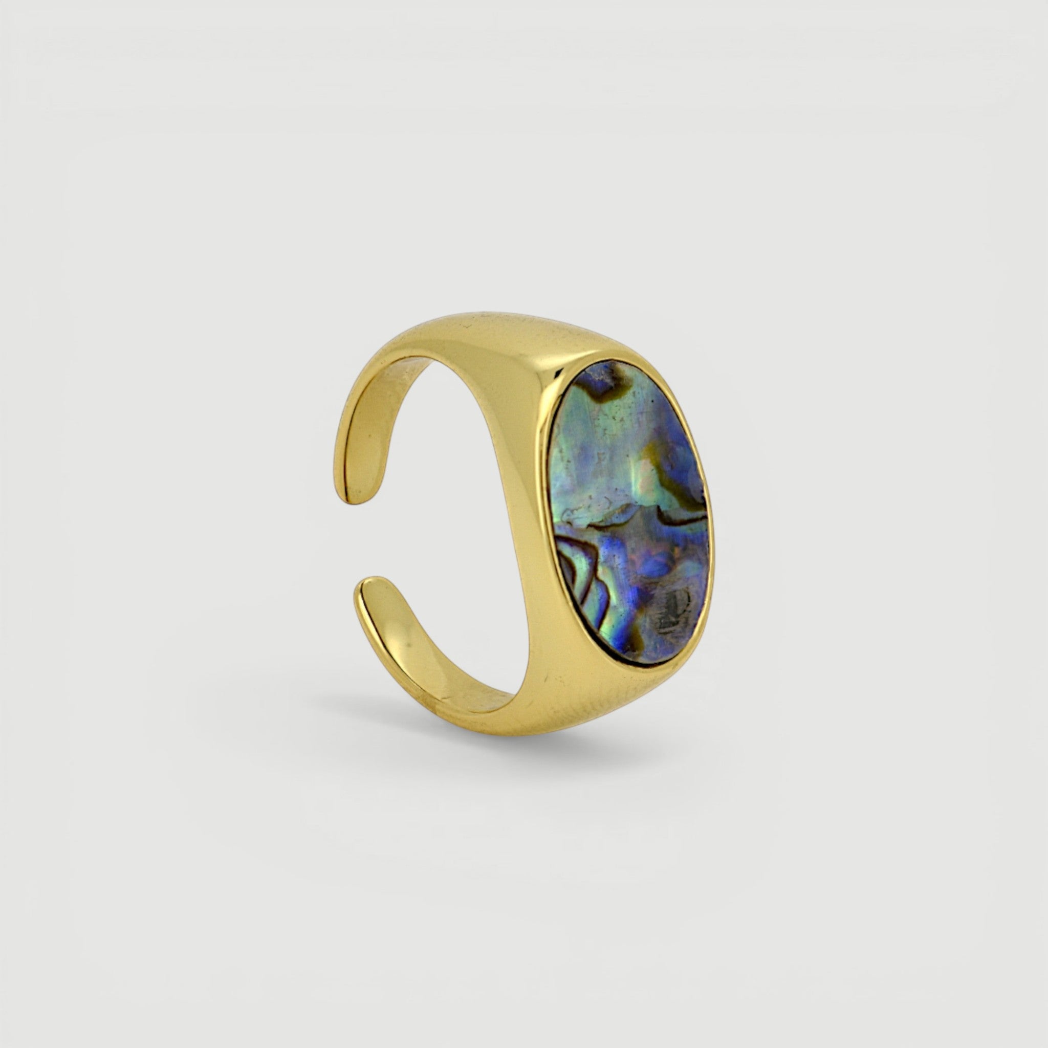 Amara Jewels gold-tone open ring with oval abalone shell inlay featuring iridescent blues, greens, and purples.