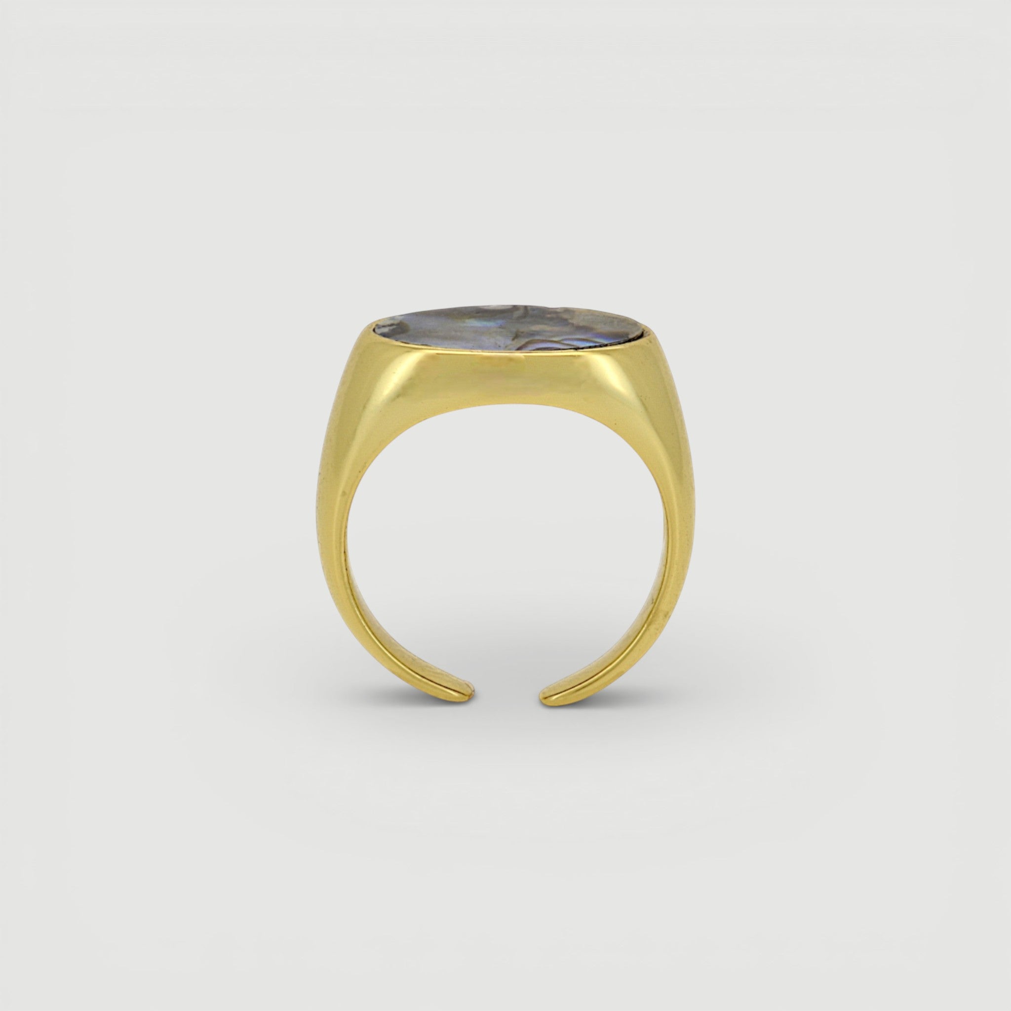 Amara Jewels gold-tone open ring with oval abalone shell inlay featuring iridescent blues, greens, and purples.