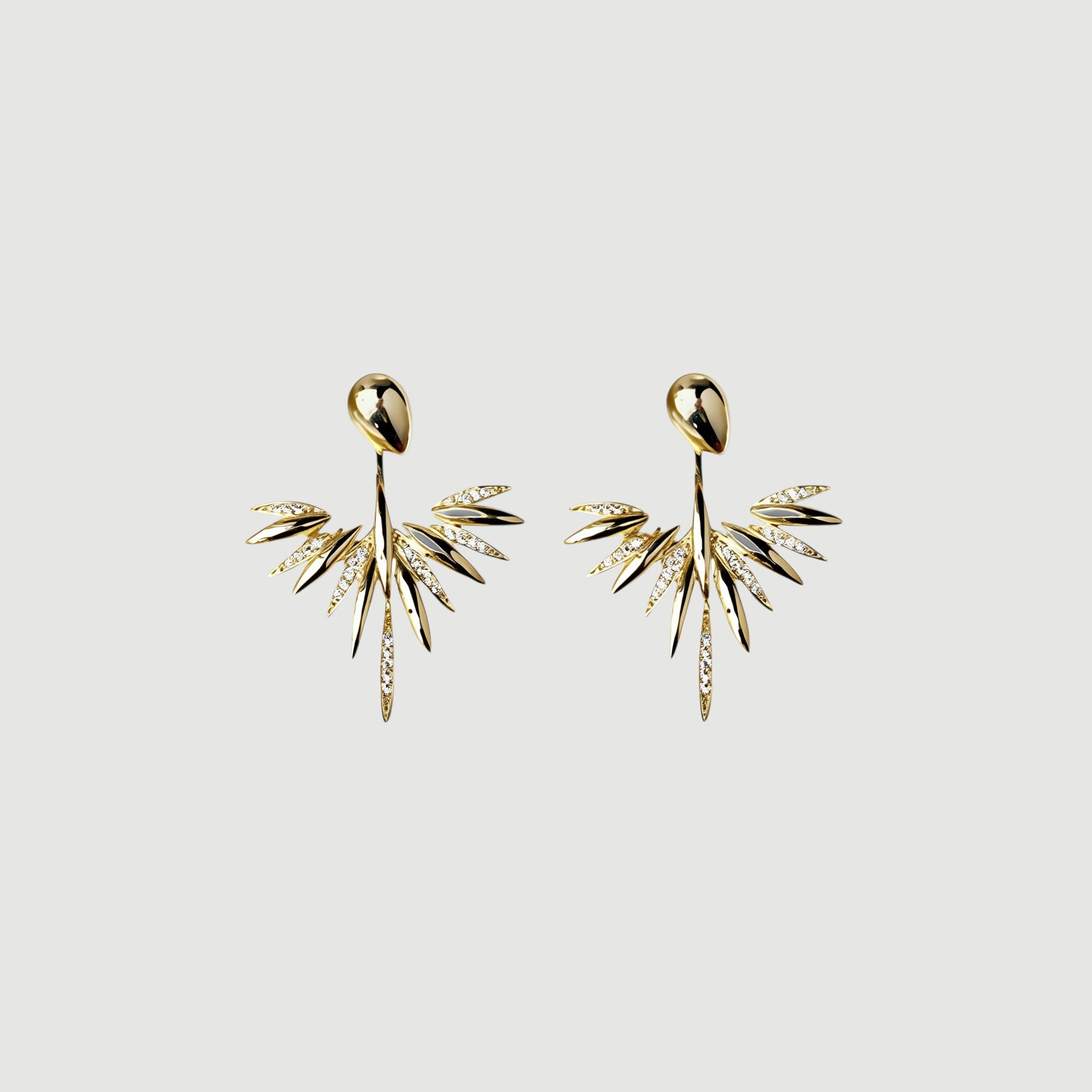 Amara Jewels 18K gold plated sterling silver leaf dangle earrings with sparkling cubic zirconia accents.