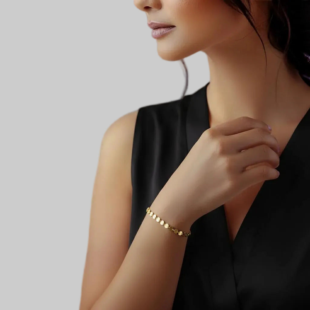 Amara Jewels gold-plated sterling silver bracelet with interlocking polished discs, adjustable chain, and lobster clasp.
