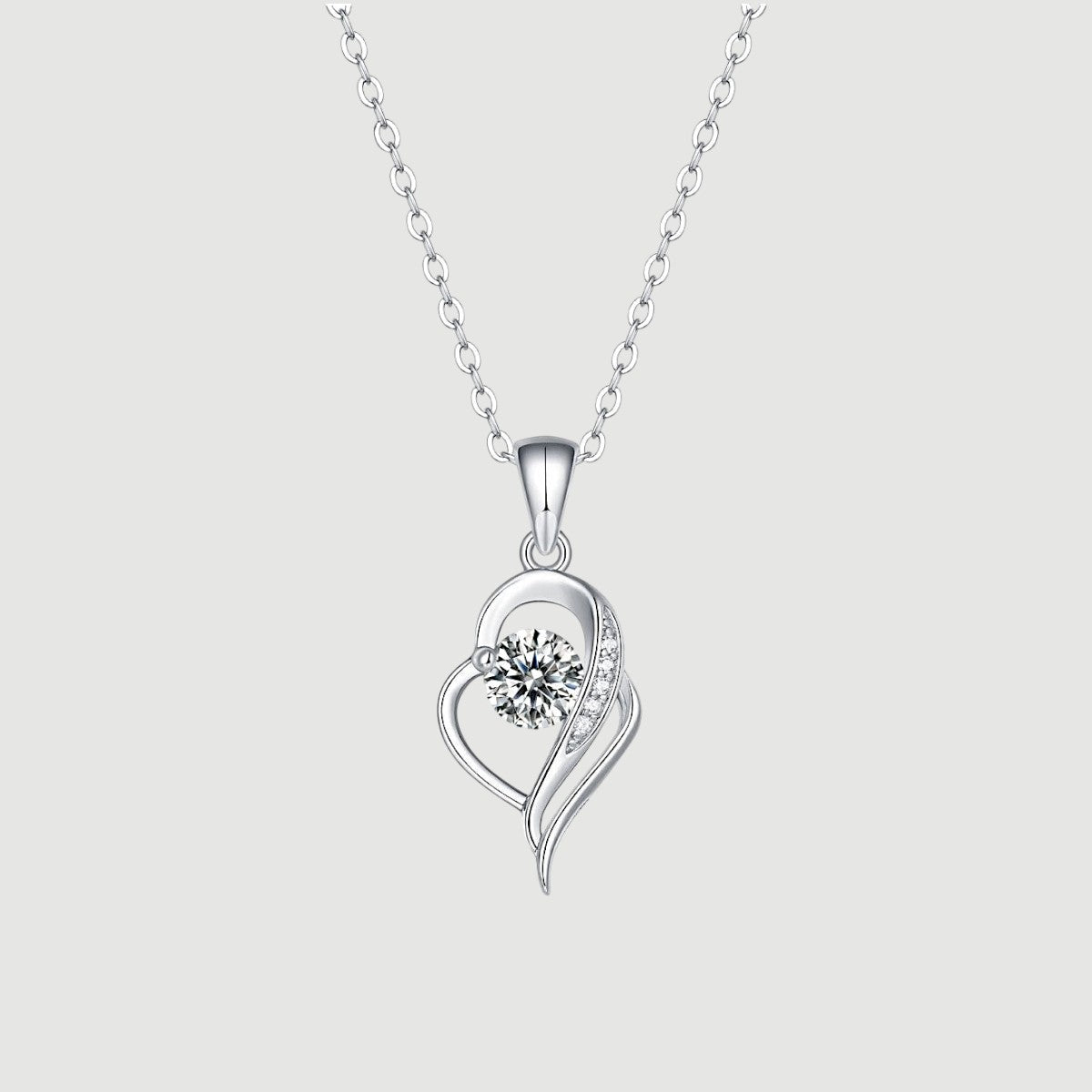 Amara Jewels sterling silver necklace with an irregular heart pendant featuring a cubic zirconia and accent stones.