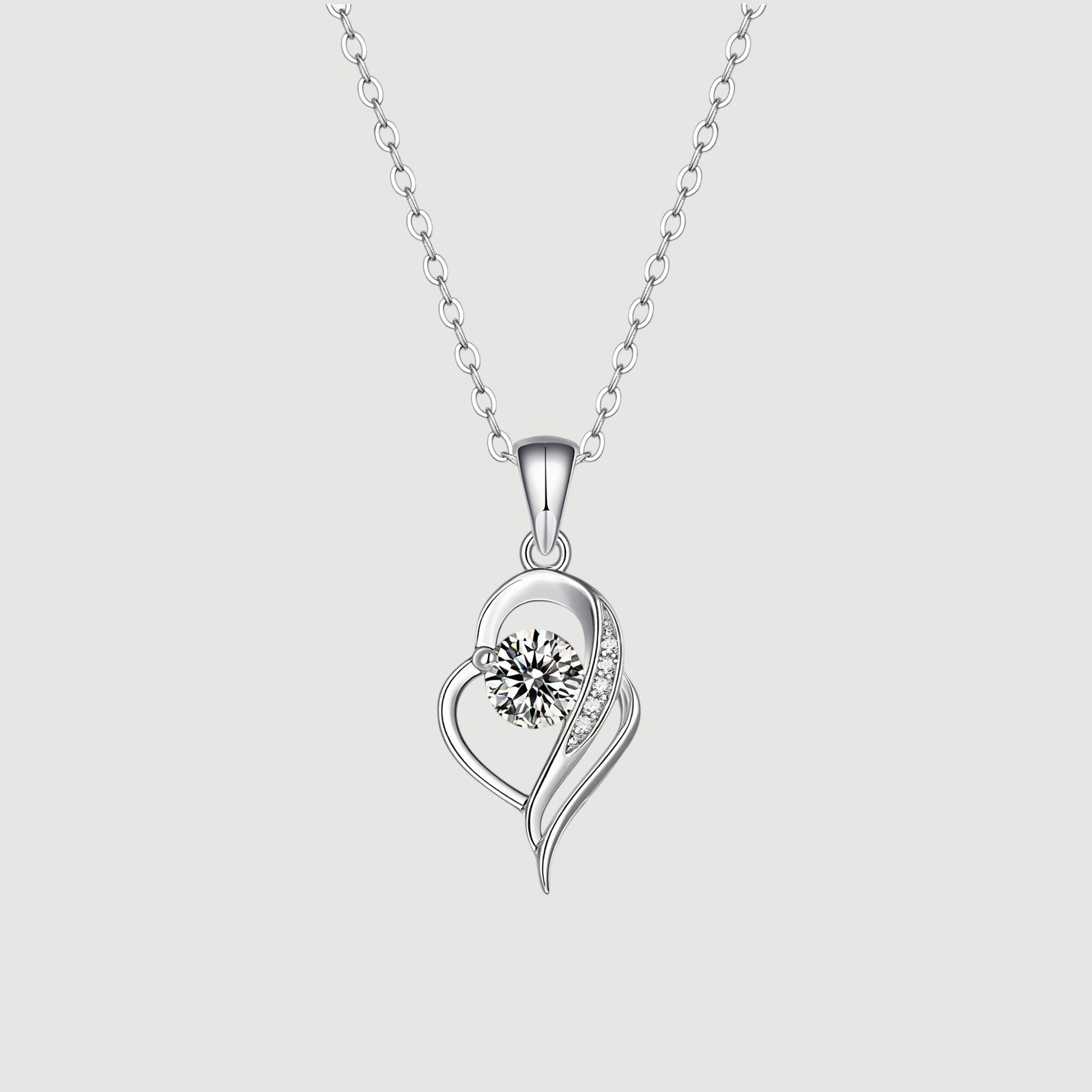Amara Jewels sterling silver necklace with an irregular heart pendant featuring a cubic zirconia and accent stones.