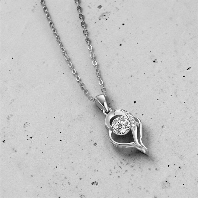 Amara Jewels sterling silver necklace with an irregular heart pendant featuring a cubic zirconia and accent stones.