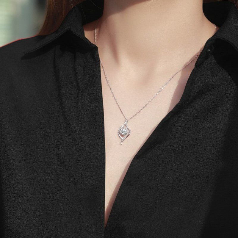 Amara Jewels Sterling Silver Infinity Twirl Pendant Necklace with round-cut crystal and small accent stones.