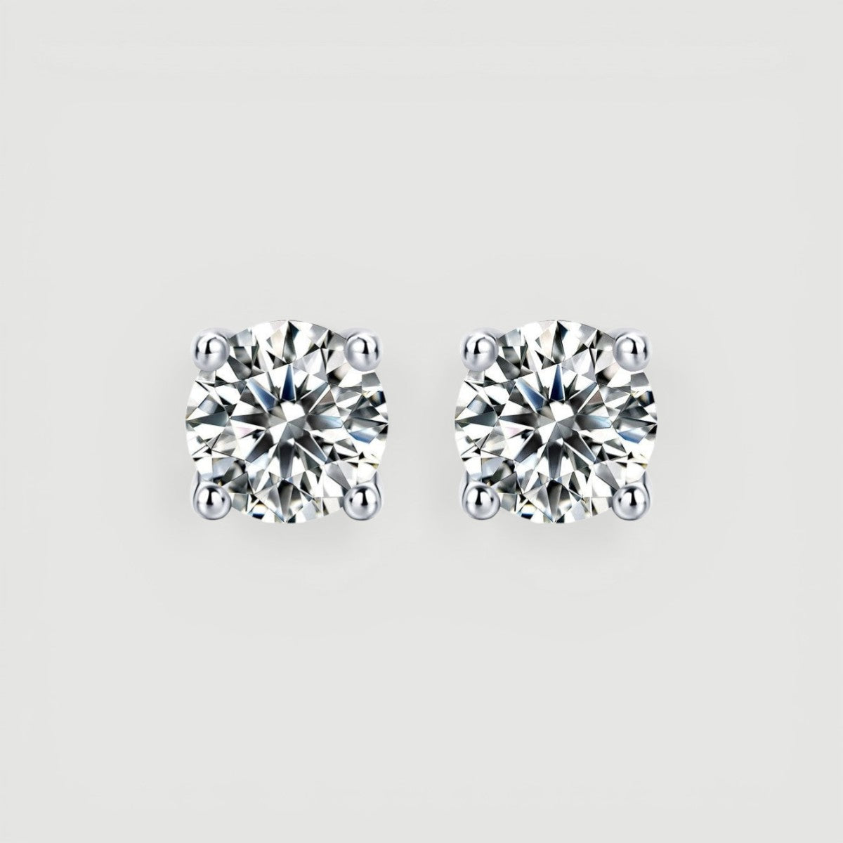 Amara Jewels sterling silver round-cut cubic zirconia Moissanite stud earrings with four-prong setting.
