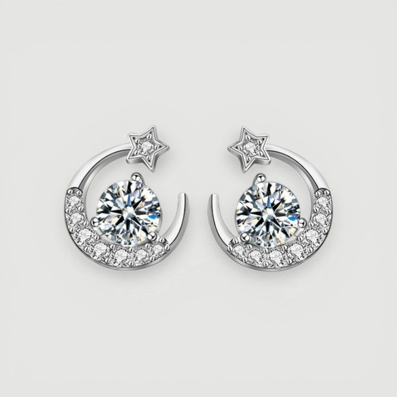 Amara Jewels Sterling Silver crescent moon stud earrings with star and clear crystals. Celestial design.