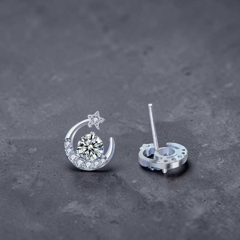 Amara Jewels Sterling Silver crescent moon stud earrings with star and clear crystals. Celestial design.