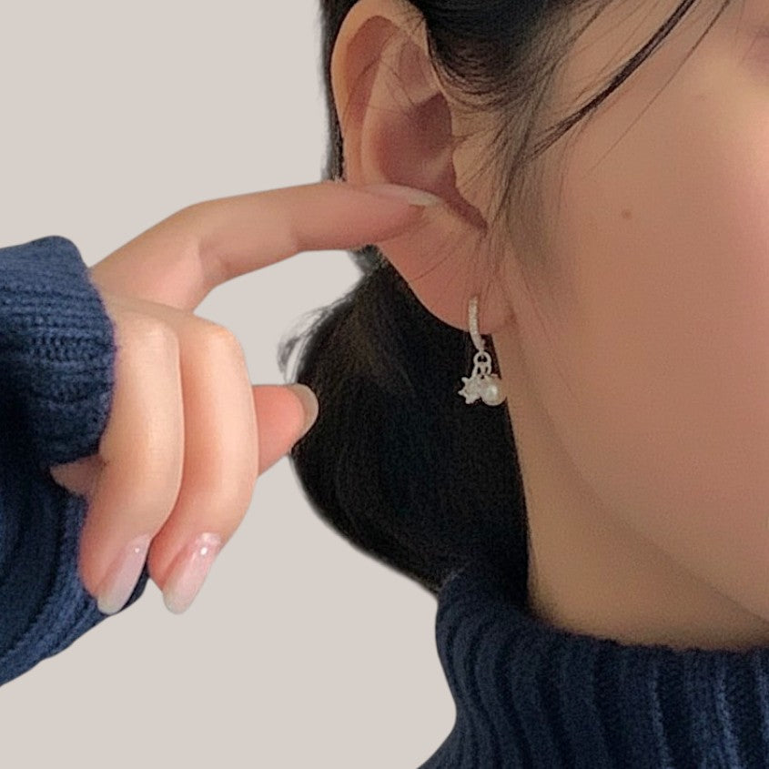 Amara Jewels sterling silver dangle earrings with pearl and crystal snowflake charms.