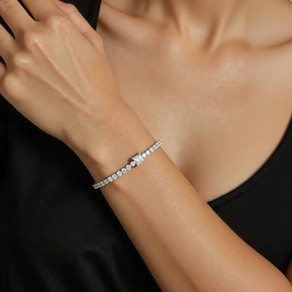 Amara Jewels 925 sterling silver tennis bracelet with princess-cut zirconia centerpiece and round-cut stones.