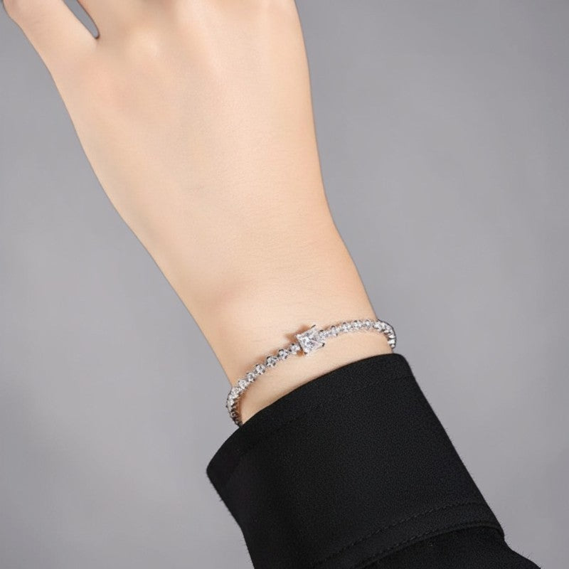 Amara Jewels 925 sterling silver tennis bracelet with princess-cut zirconia centerpiece and round-cut stones.