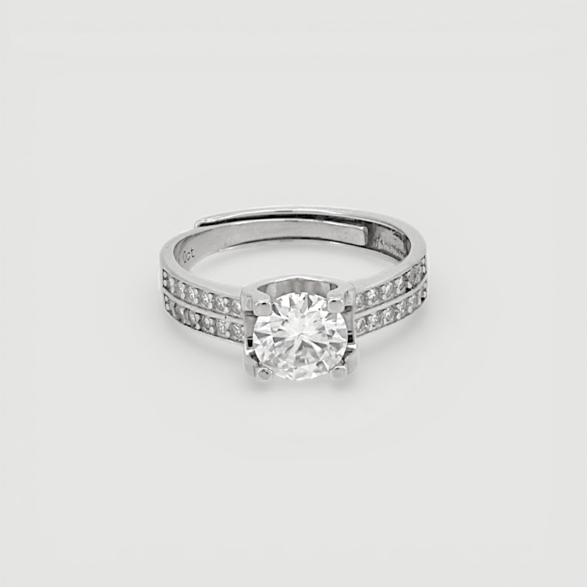 Amara Jewels Sterling Silver adjustable ring with round-cut solitaire and pave CZ band.