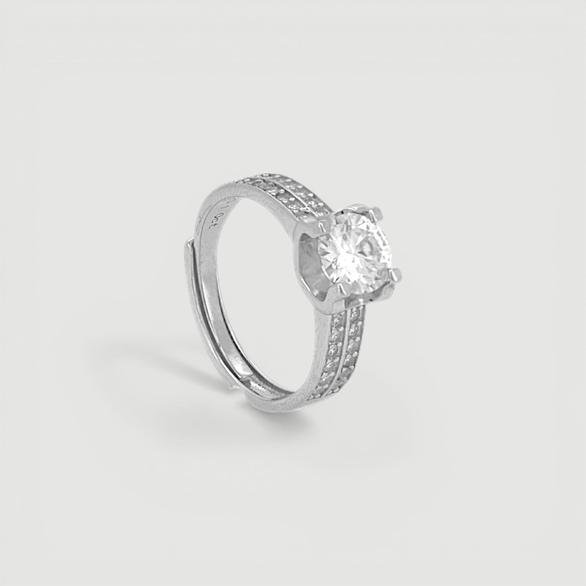 Amara Jewels Sterling Silver adjustable ring with round-cut solitaire and pave CZ band.