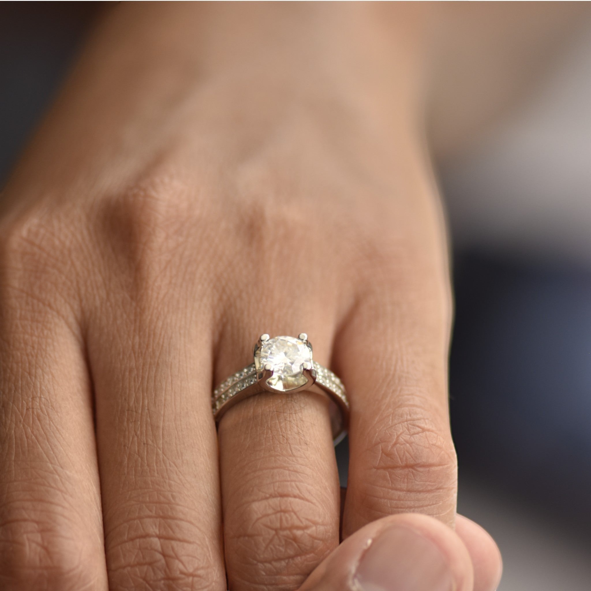 Amara Jewels Sterling Silver adjustable ring with round-cut solitaire and pave CZ band.