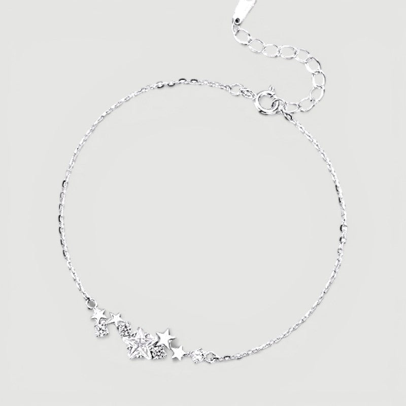 Amara Jewels sterling silver bracelet with a cluster of five sparkling cubic zirconia stars and an adjustable chain.