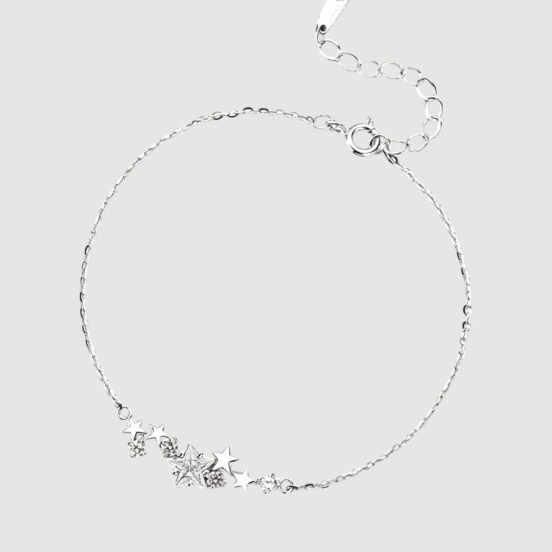 Amara Jewels sterling silver bracelet with a cluster of five sparkling cubic zirconia stars and an adjustable chain.