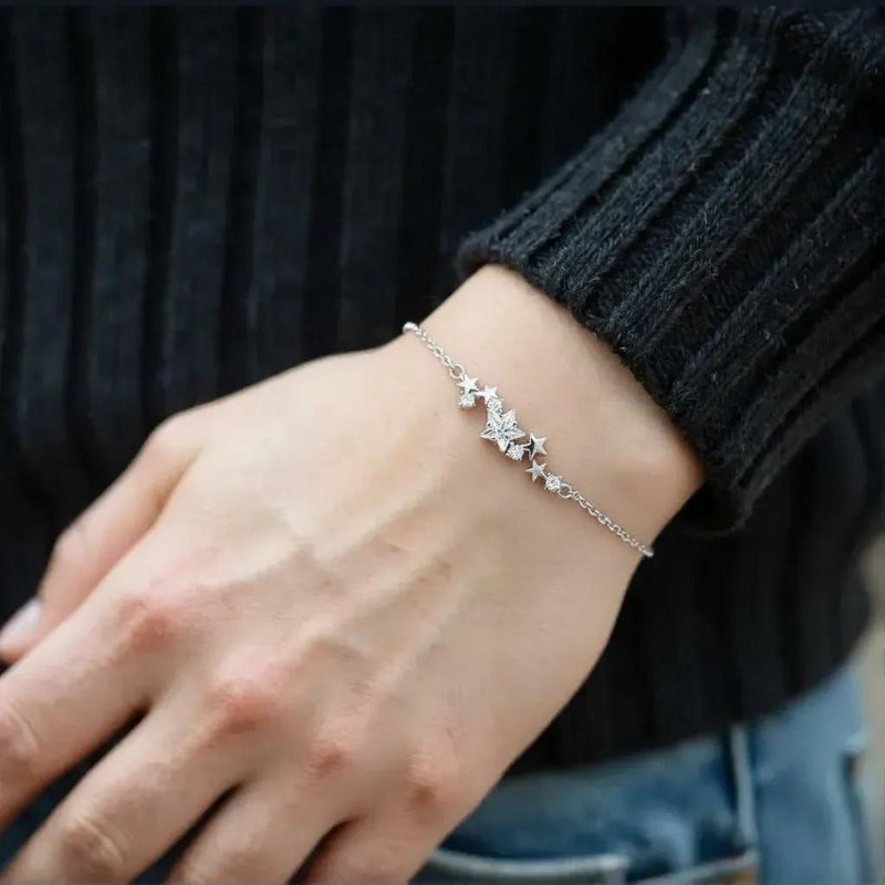 Amara Jewels sterling silver bracelet with a cluster of five sparkling cubic zirconia stars and an adjustable chain.