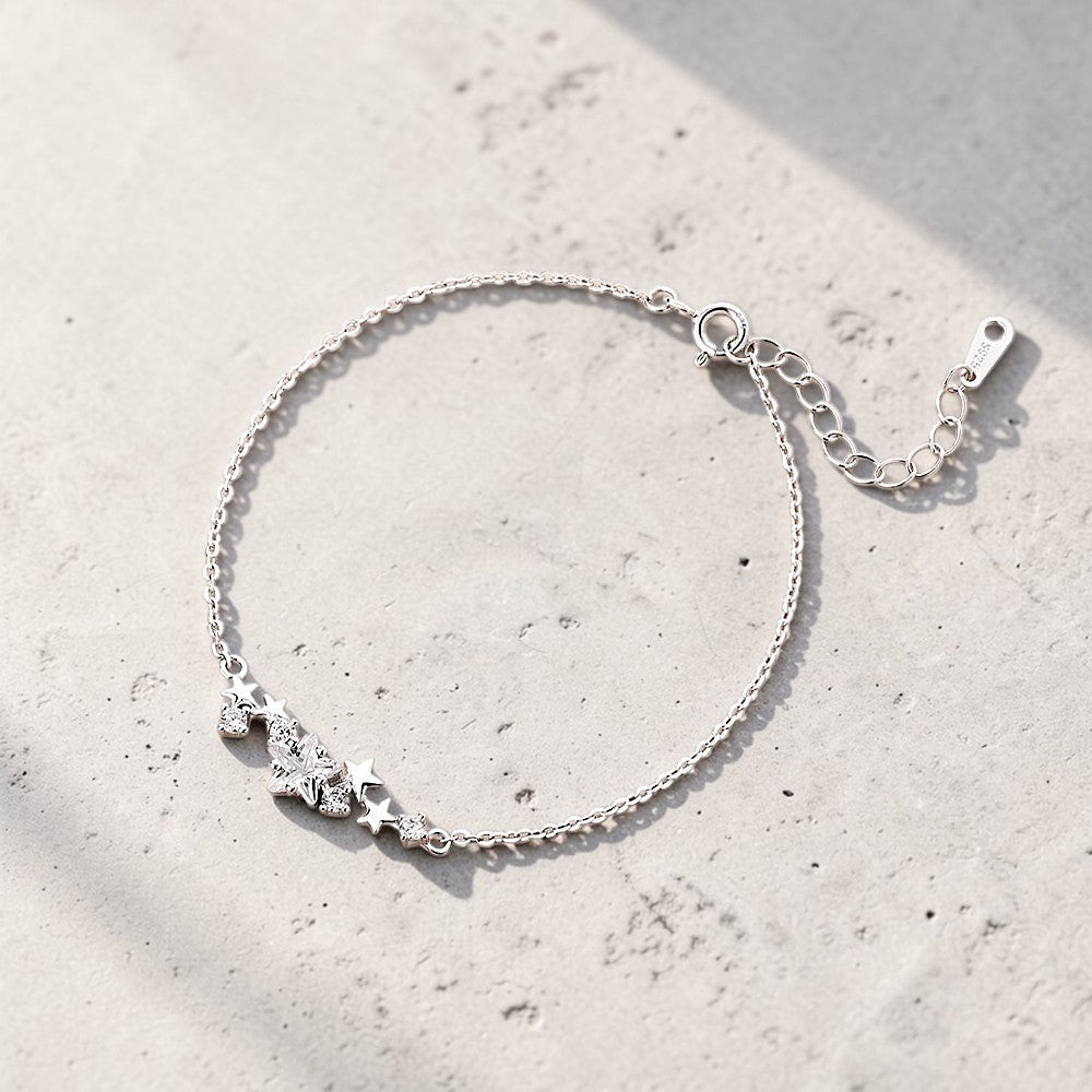 Amara Jewels sterling silver bracelet with a cluster of five sparkling cubic zirconia stars and an adjustable chain.