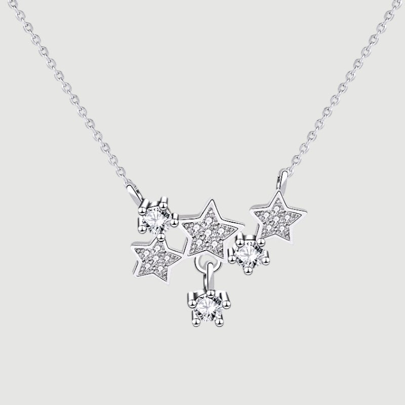 Amara Jewels sterling silver necklace with a cluster of sparkling star pendants adorned with crystals.