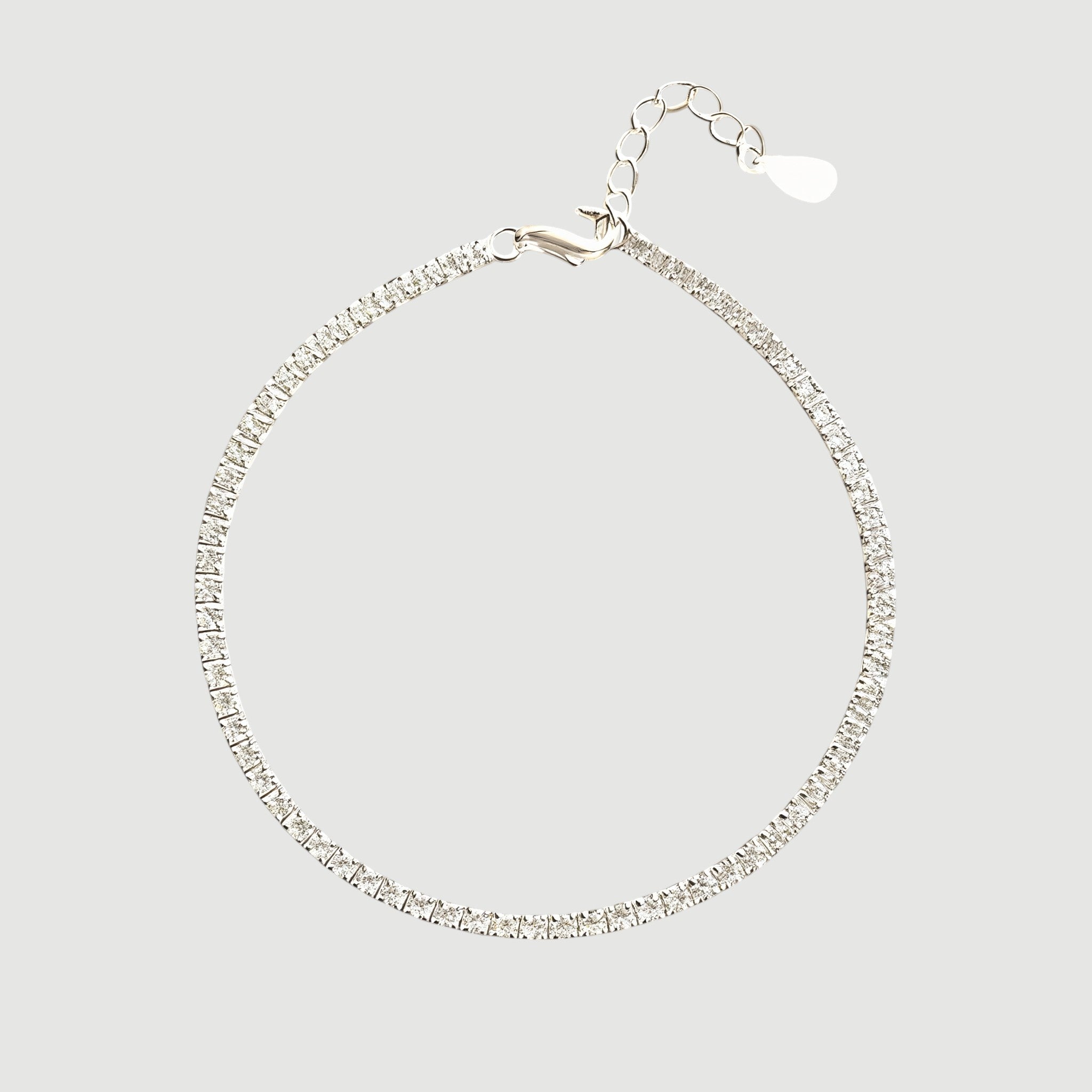 Amara Jewels classic tennis bracelet with white-plated sterling silver and sparkling stones, adjustable clasp.