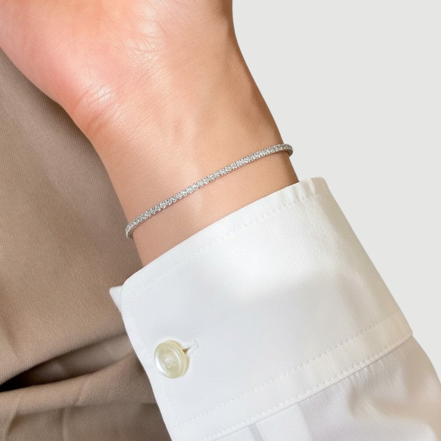 Amara Jewels classic tennis bracelet with white-plated sterling silver and sparkling stones, adjustable clasp.