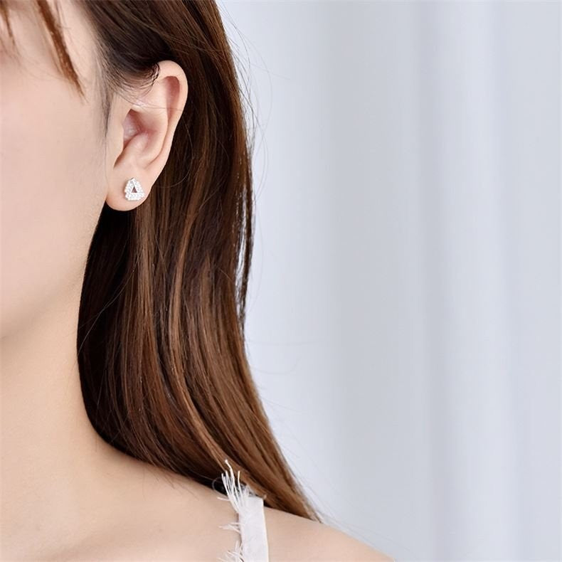 Amara Jewels rhodium-plated sterling silver open triangle stud earrings with cubic zirconia.