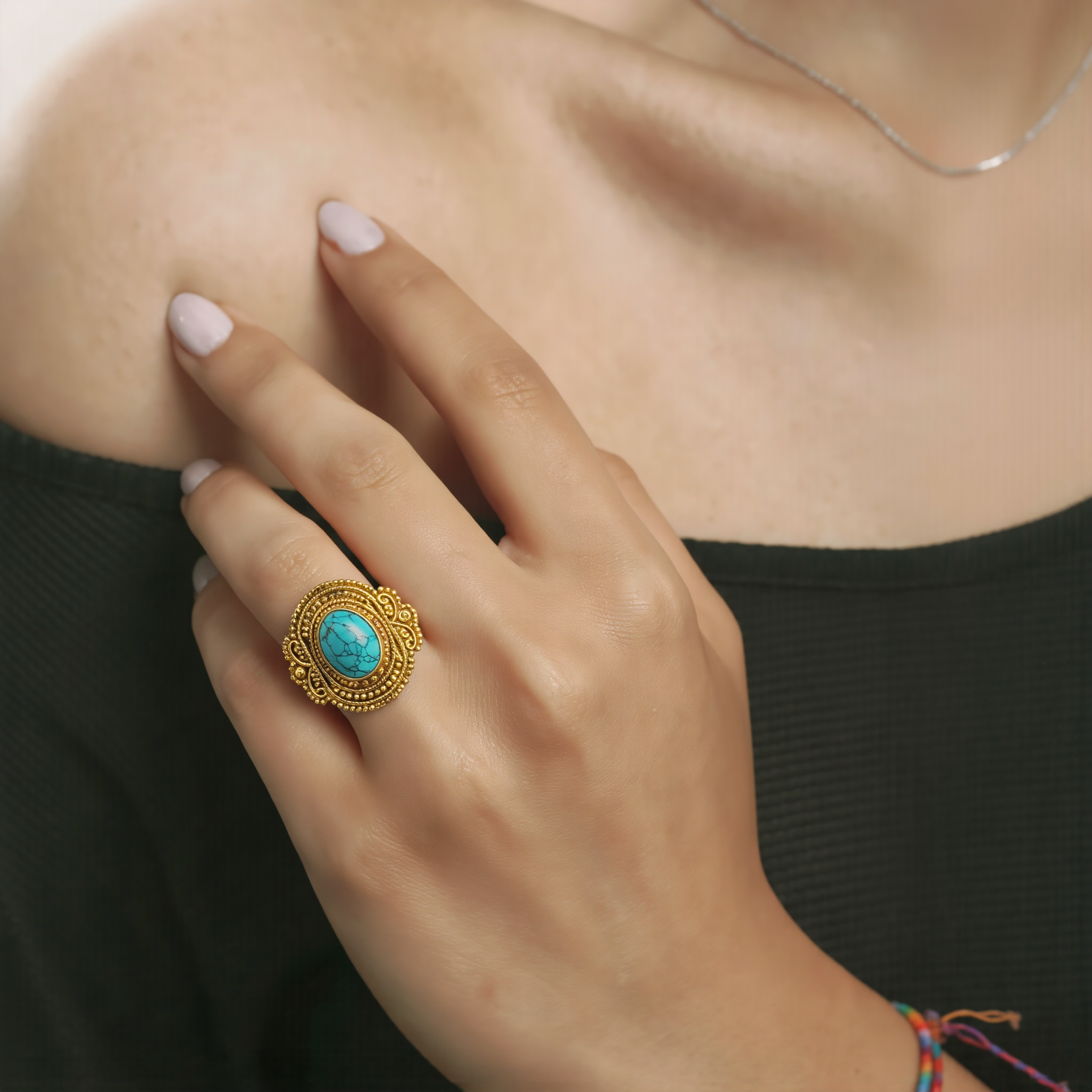Amara Jewels antique-inspired oval turquoise ring with intricate gold detailing on sterling silver with 18K gold plating.