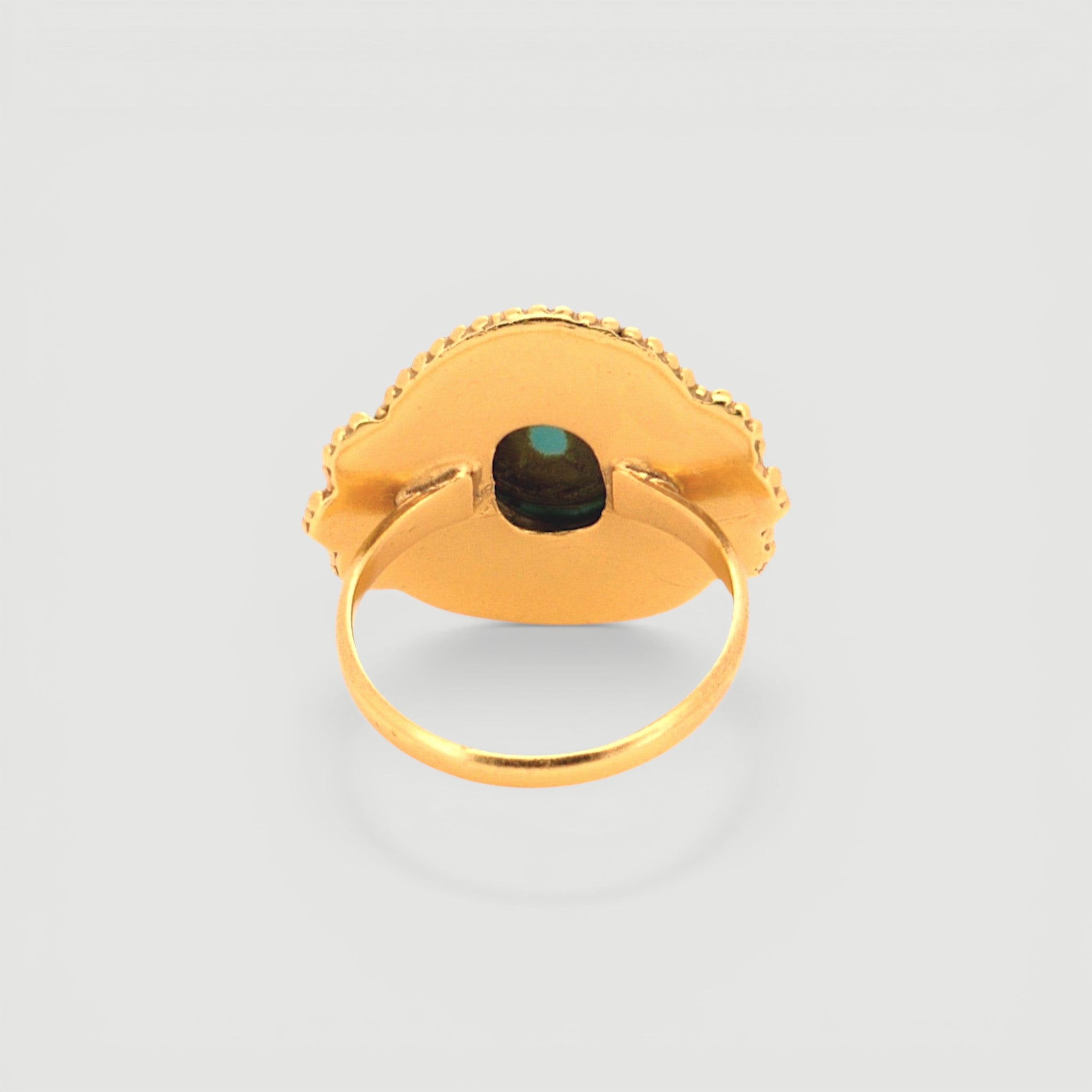 Amara Jewels antique-inspired oval turquoise ring with intricate gold detailing on sterling silver with 18K gold plating.