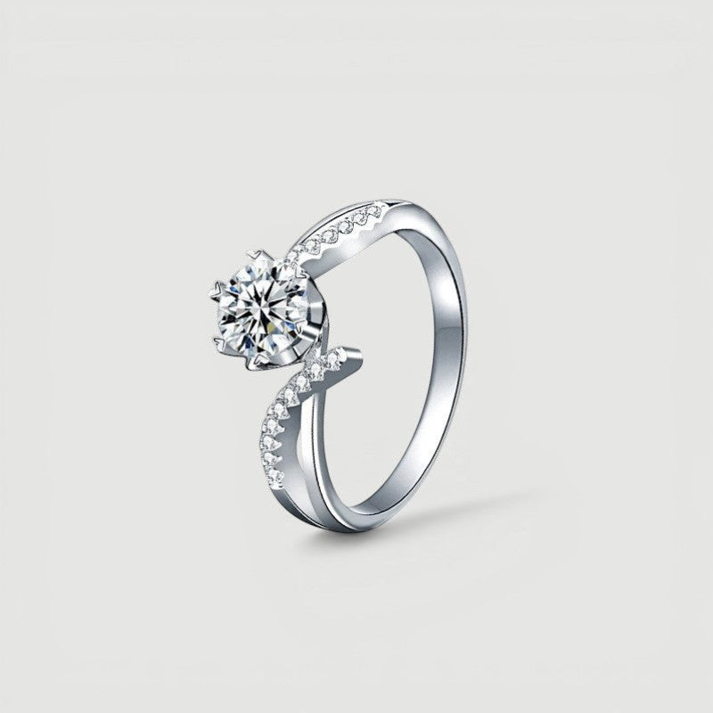 Amara Jewels sterling silver twisted band ring with round-cut solitaire and accent stones.