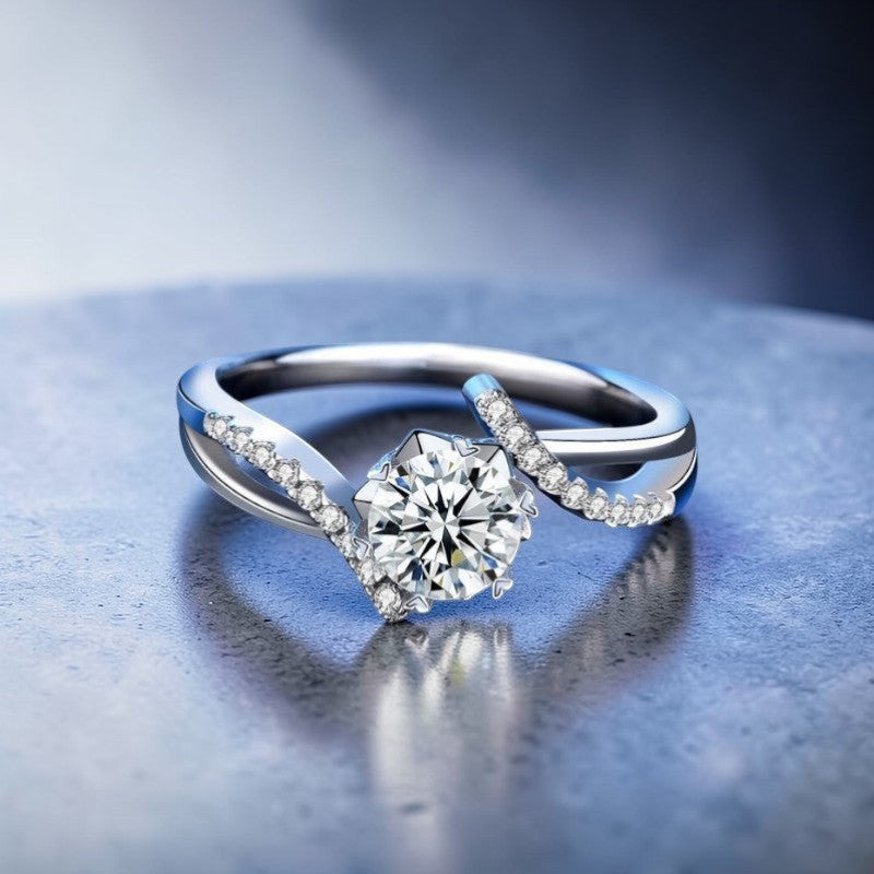 Amara Jewels sterling silver twisted band ring with round-cut solitaire and accent stones.