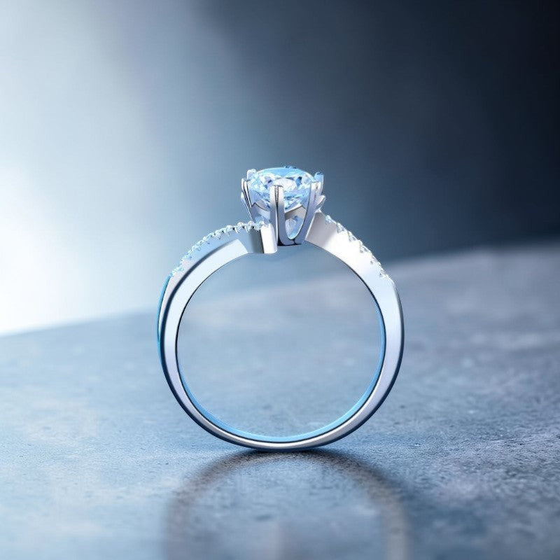 Amara Jewels sterling silver twisted band ring with round-cut solitaire and accent stones.