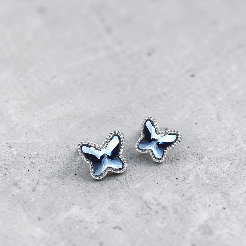 Amara Jewels blue crystal butterfly stud earrings with beaded sterling silver frame.