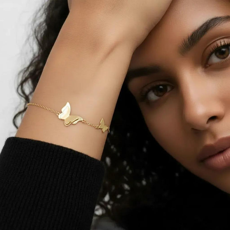 Amara Jewels delicate gold-plated 925 sterling silver bracelet with two butterfly charms and an adjustable chain.