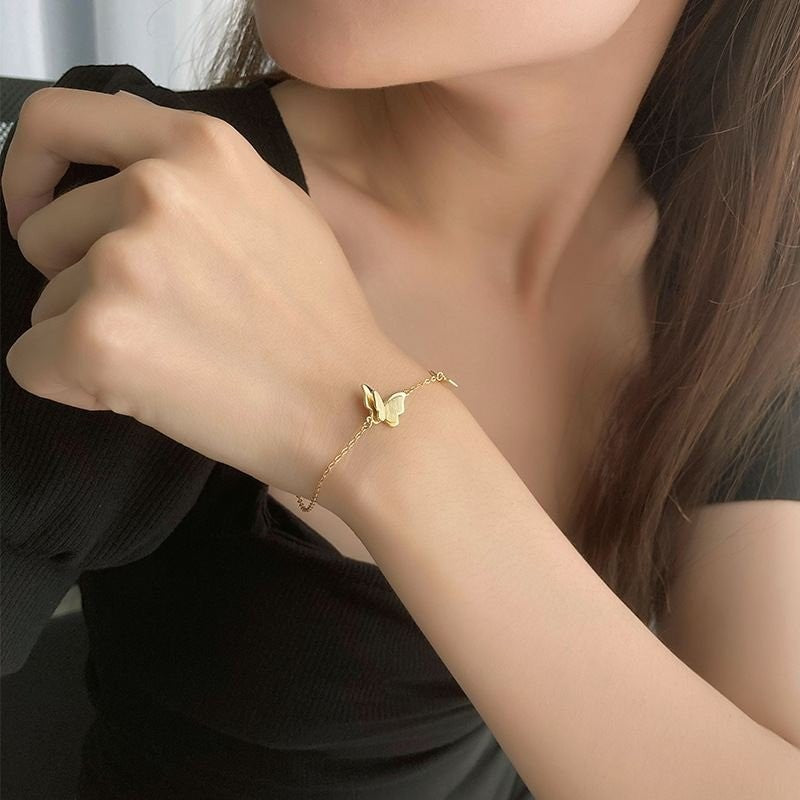 Amara Jewels delicate gold-plated 925 sterling silver bracelet with two butterfly charms and an adjustable chain.