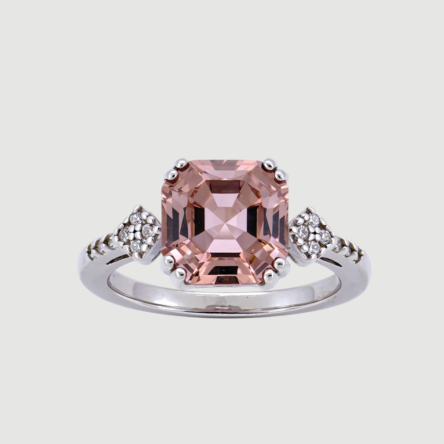 Amara Jewels 925 sterling silver ring with a square-cut pink sapphire and small zirconia accents on the band.